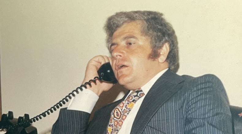 Young Stan Chesley works the phones. PHOTO PROVIDED BY LAUREN CHESLEY MILLER