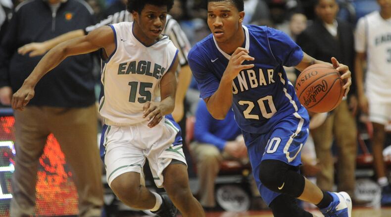 Dunbar’s Devon Baker (with ball) beats CJ defender Milton Gage. CJ played Dunbar in a boys high school basketball D-II sectional final at UD Arena on Saturday, March 4, 2017. MARC PENDLETON / STAFF