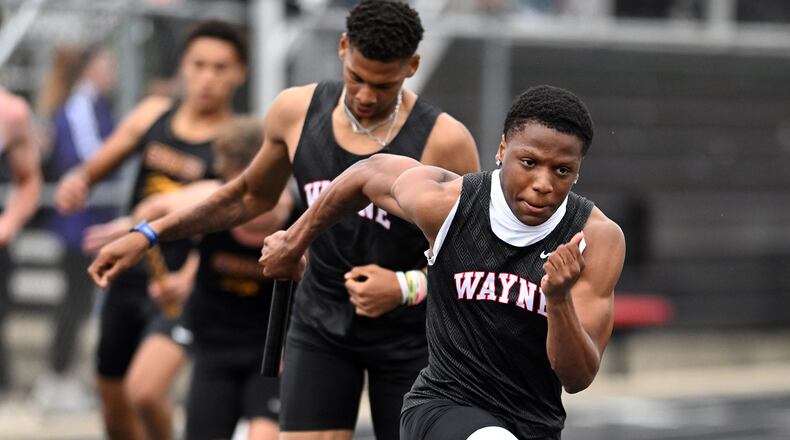 Wayne's Key'Shawn Garrett hands off to Semarion Sroufe during the 800 meter relay race at the Wayne Invitational on Friday, May 2 at Heidkamp Stadium in Huber Heights. Nick Falzerano/CONTRIBUTED PHOTO