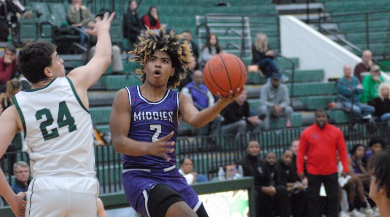 Middletown sophomore Jeremiah Landers looks to put up a shot against Mason senior Ben Golan on Dec. 13, 2022. Chris Vogt/CONTRIBUTED
