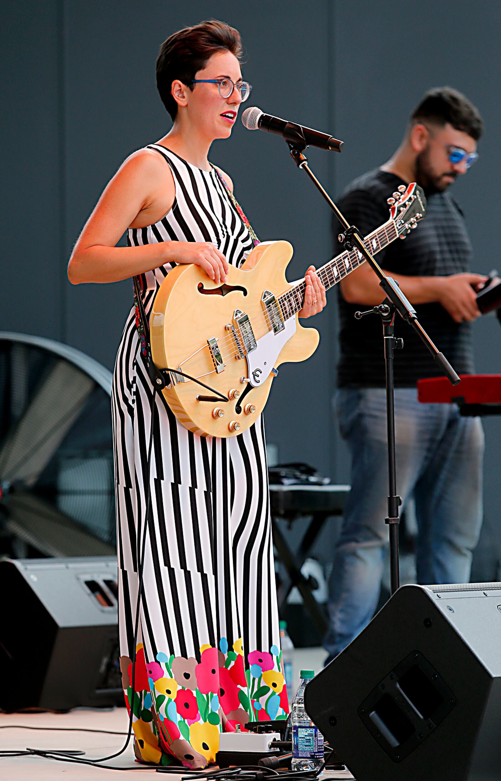 Texas-based singer Gina Chavez performs at the Levitt Pavilion in a dress she bought from Clash in Dayton.