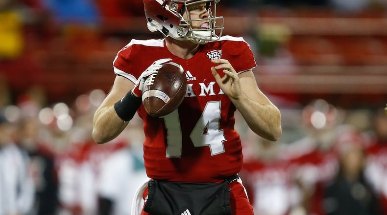 OXFORD, OH - NOVEMBER 07: Gus Ragland #14 of the Miami Ohio Redhawks looks to pass against the Akron Zips during the first half at Yager Stadium on November 7, 2017 in Oxford, Ohio. (Photo by Michael Reaves/Getty Images)