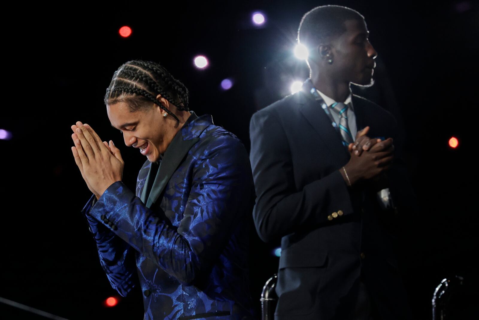 Yanic Konan Niederhauser, left, after being selected 30th by the Los Angeles Clippers in the first round of the NBA basketball draft, Wednesday, June 25, 2025, in New York. (AP Photo/Adam Hunger)