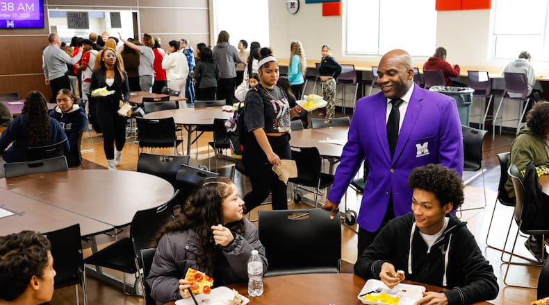 Middletown High School remains abuzz with excitement this week over its Ohio playoff football team that has gone further in the tournament than any other squad in the last 35 years. This season now includes a regional title match this Friday and a shot to make the Ohio semi-finals and possibly a state championship.
Middletown High School Principal Donetrus Hill, sporting a Middie purple suit jacket, paused from his busy rounds during Monday’s classes and talked about the electricity students and staff are getting from the team. (Photo By Nick Graham/Journal-News)