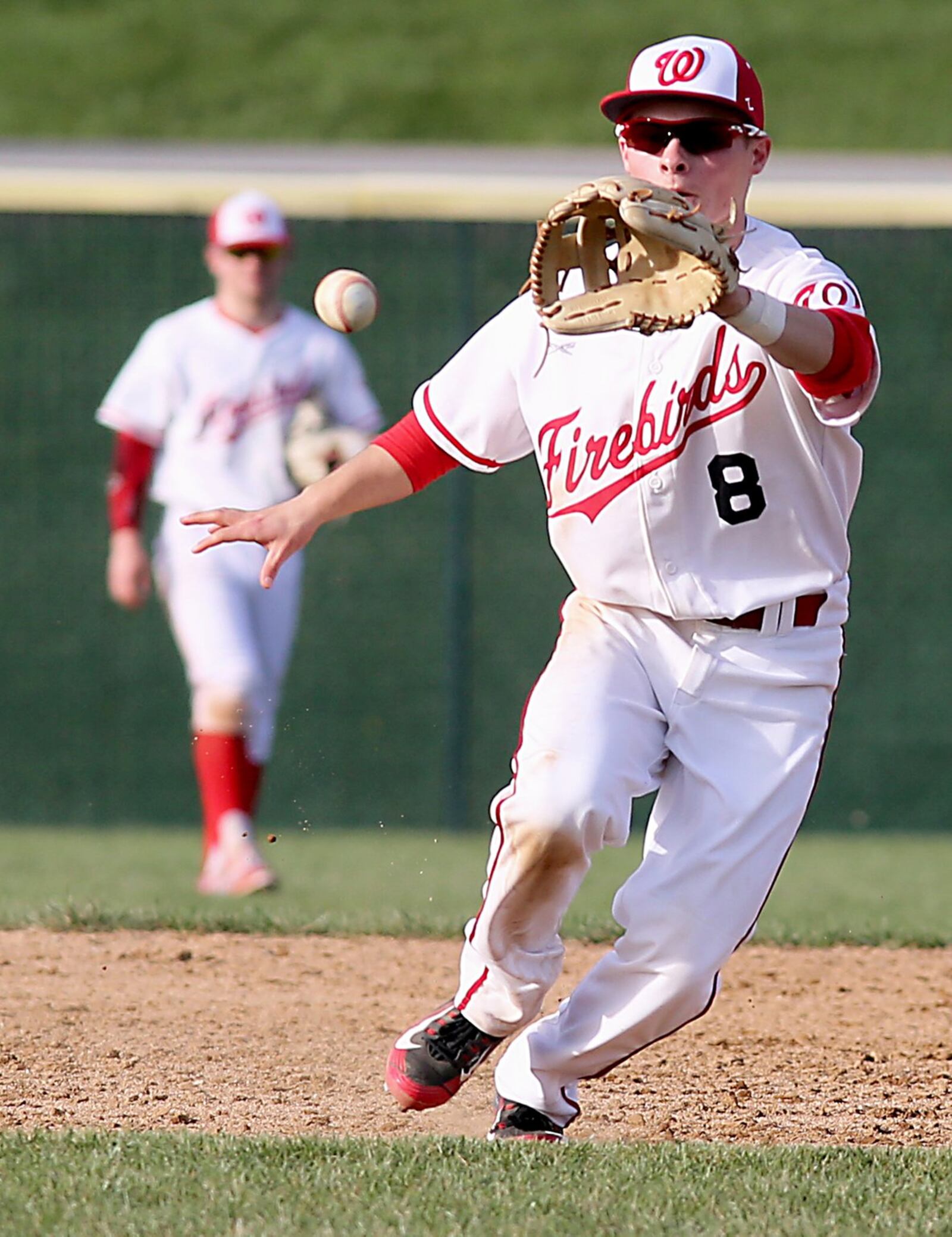 Lakota West shortstop A.J. Petersen fields a Hamilton ground ball during Sunday’s game in West Chester Township. CONTRIBUTED PHOTO BY E.L. HUBBARD