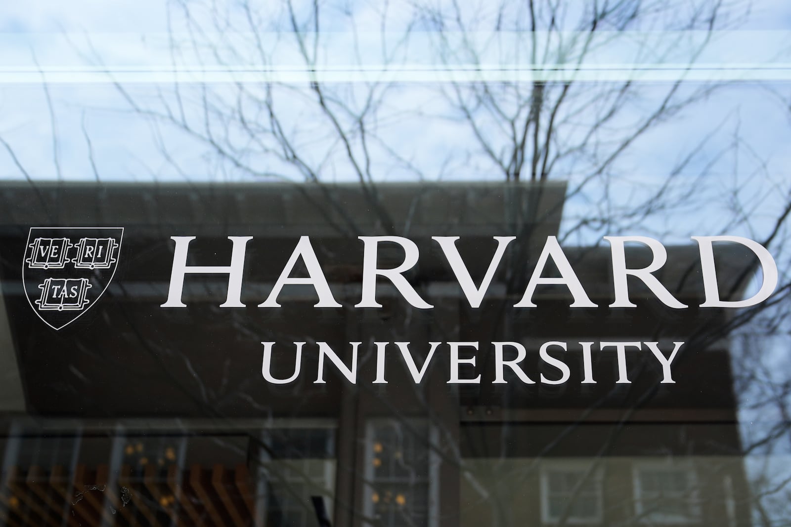 The Harvard University logo is displayed on a building at the school, Tuesday, April 15, 2025, in Cambridge, Mass. (AP Photo/Charles Krupa)