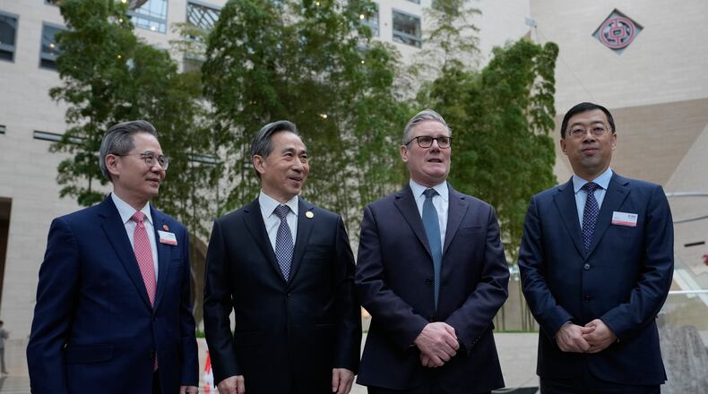 From left, Zheng Zeguang, Chinese ambassador to to Britain, Ren Hongbin, Chairman of the China Council for the Promotion of International Trade (CCPIT), Britain's Prime Minister Keir Starmer and Ge Haijiao, Chairman and Executive Director of the Bank of China Limited (BOC) pose for photos in Beijing, China, Friday, Jan. 30, 2026. (AP Photo/Kin Cheung, Pool)