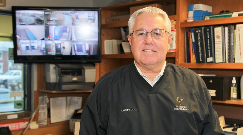 Trenton Police Chief Arthur Scott recently honored two of the police officers in his department for their efforts investigating a runaway teen case. GREG LYNCH / STAFF