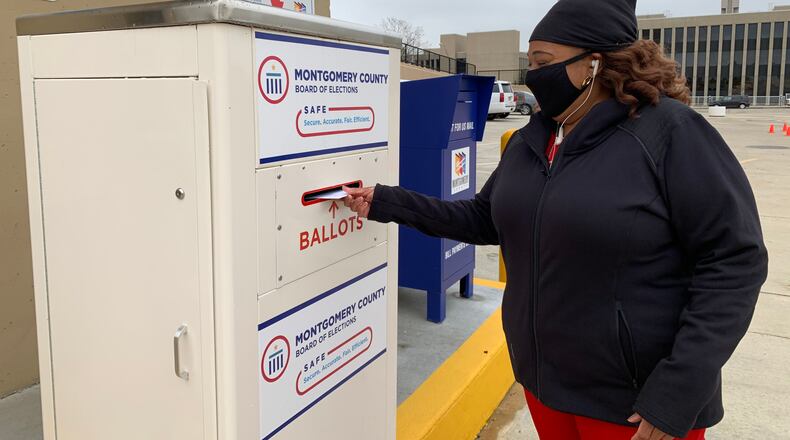 Yolanda Clark of Jefferson Twp. casts her ballot using a drop box at the Montgomery County Board of Elections Wednesday, Oct. 28.