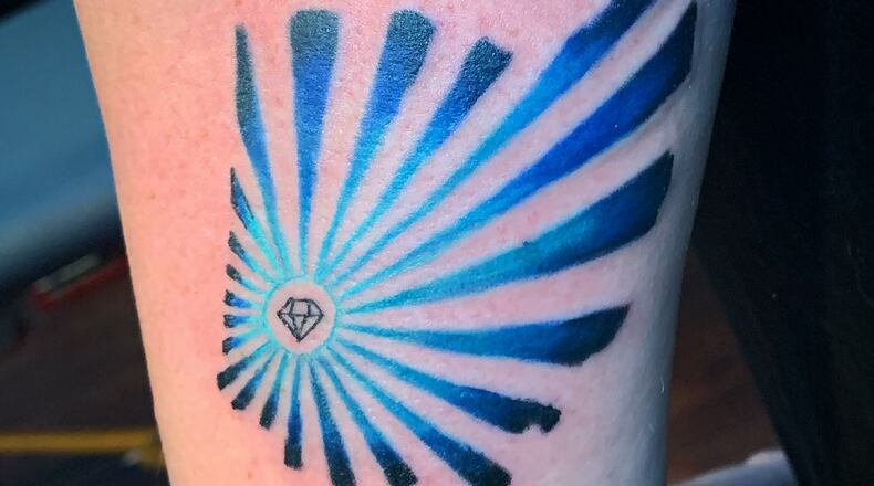 Since the Aug. 4 shooting in the Oregon District, local residents have flocked to local tattoo parlors  to get some type of love note to Dayton. CONTRIBUTED