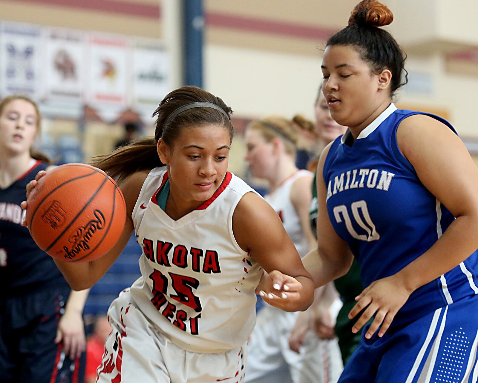 Lakota West’s Sarah Jones puts a move on Hamilton’s DeSuela Rodriguez during the inaugural All-Butler County All-Star girls basketball game at the Hamilton Athletic Center on Saturday. CONTRIBUTED PHOTO BY E.L. HUBBARD