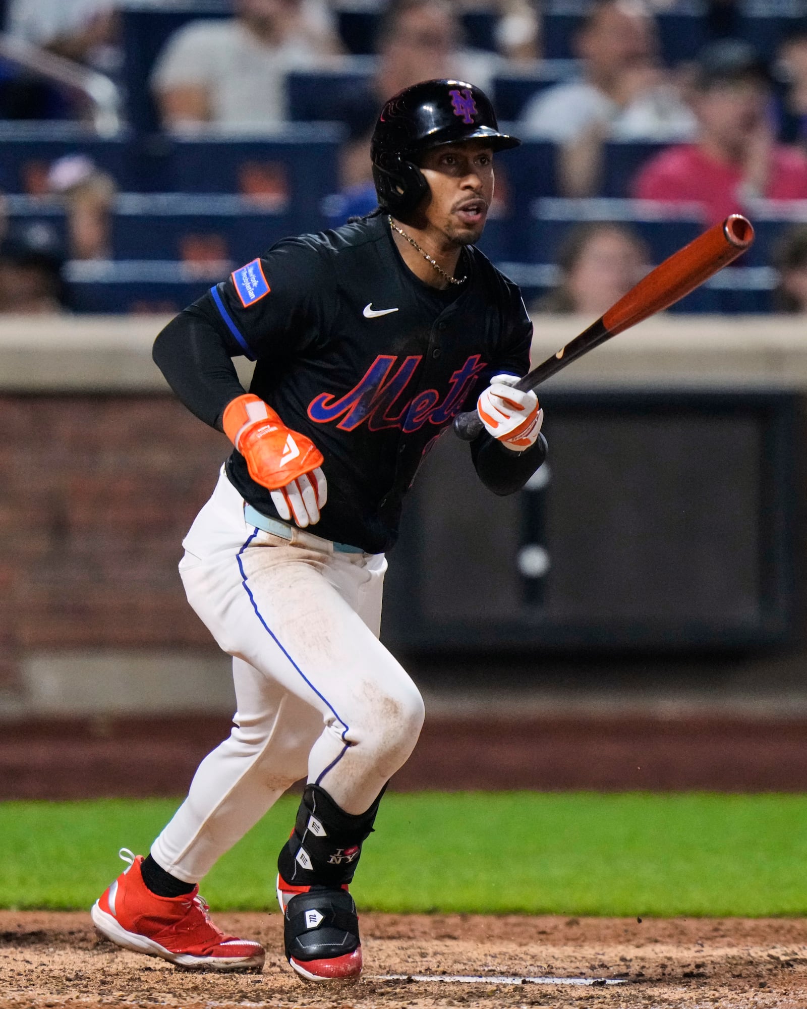 New York Mets' Francisco Lindor (12) hits an RBI double during the eighth inning in the second baseball game of a doubleheader against the Milwaukee Brewers Wednesday, July 2, 2025, in New York. (AP Photo/Frank Franklin II)