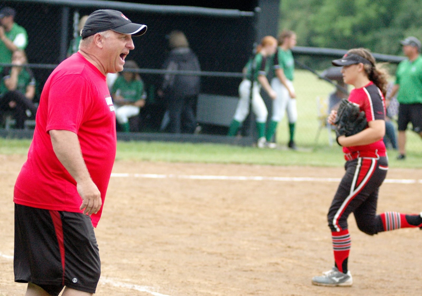 Lakota West coach Keith Castner reacts at the end of an inning Wednesday during a 2-0 victory over Harrison in a Division I regional softball semifinal at Centerville. RICK CASSANO/STAFF