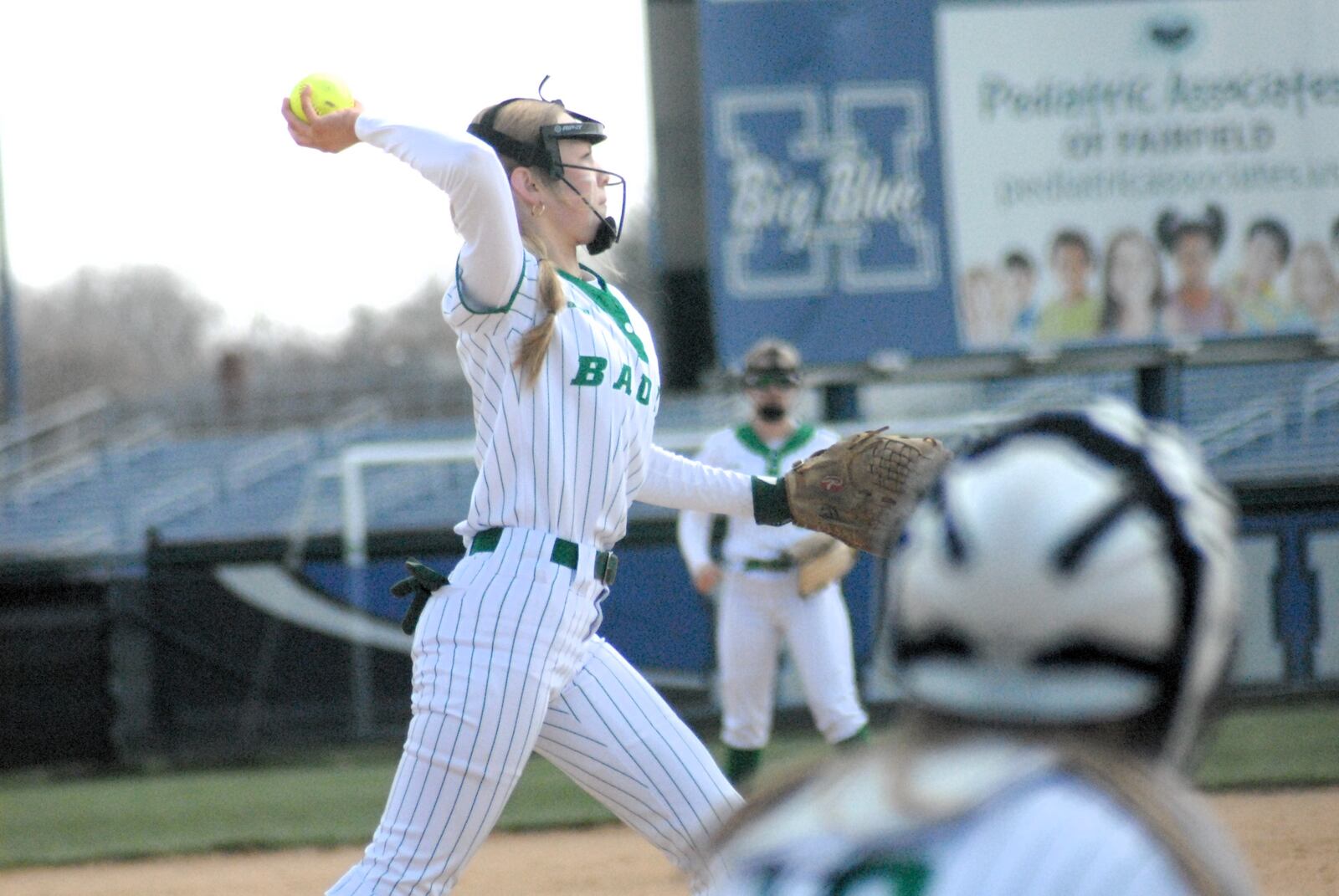 Badin's Emily O'Brien makes a throw to first base against Hamilton on Saturday. Chris Vogt/CONTRIBUTED