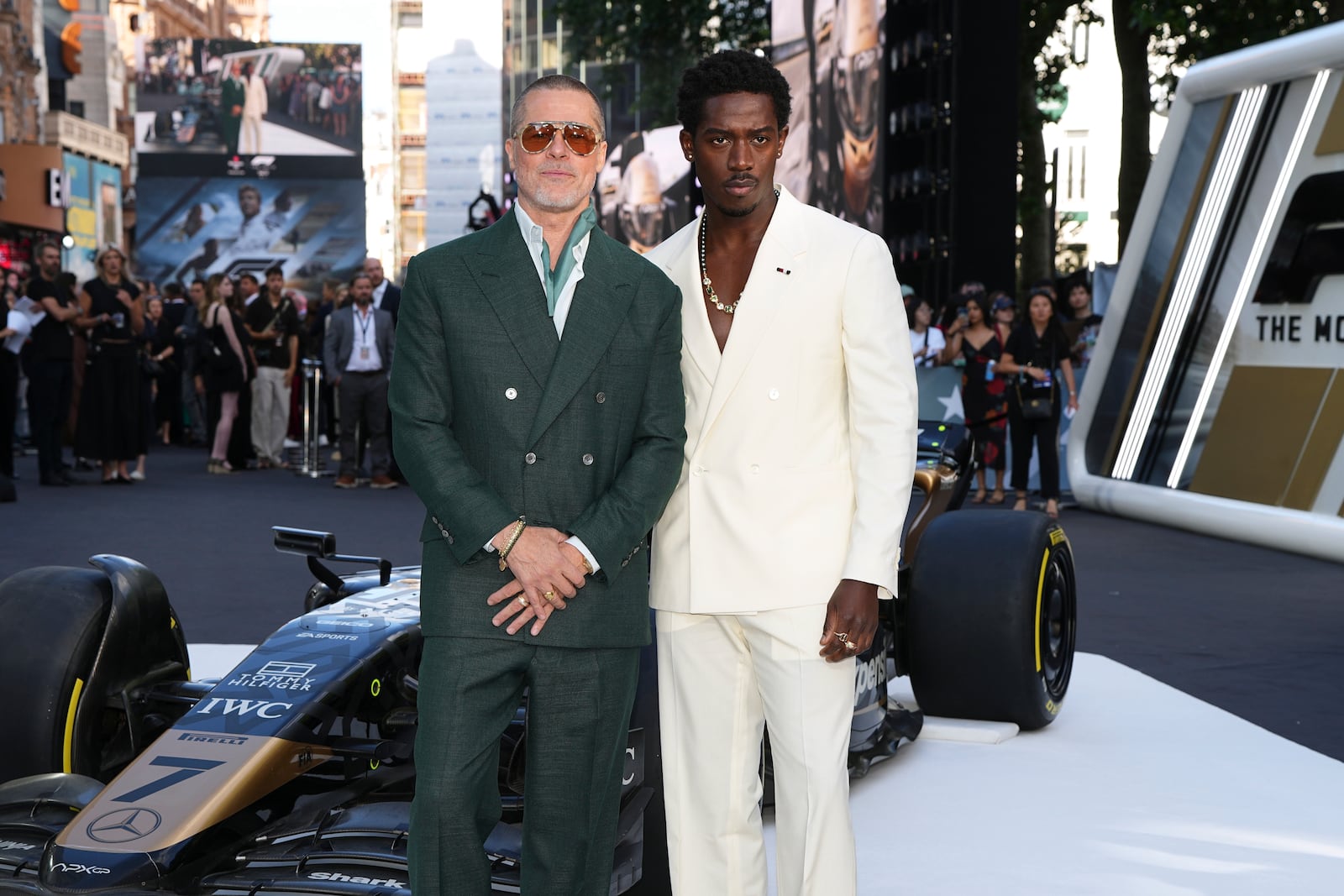 Brad Pitt, left, and Damson Idris pose for photographers upon arrival at the premiere of the film 'F1 The Movie' on Monday, June 23, 2025, in London. (Photo by Scott A Garfitt/Invision/AP)