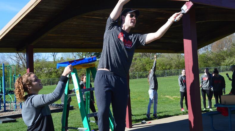 The picnic shelter at Merry Day Park got a fresh coat of paint as part of the work day at the park which involved community members and Miami athletes in an improvement project. CONTRIBUTED/BOB RATTERMAN