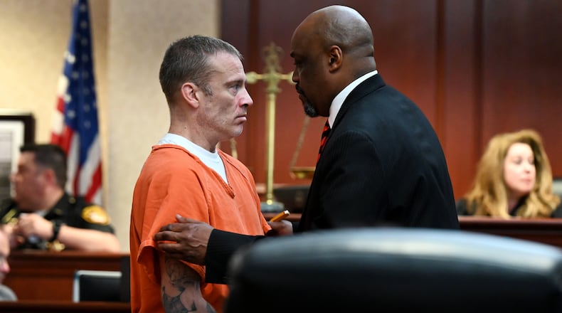 Michael Dean Withrow is pictured on Thursday, May 1 talking with his attorney, David Washington, during his hearing before Butler County Common Pleas Court Jennifer McElfresh. He will be back in court on May 19. MICHAEL D. PITMAN/STAFF