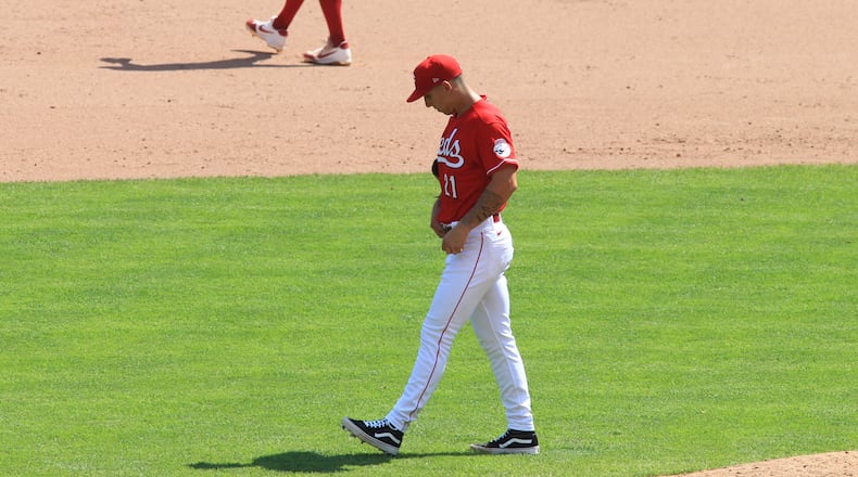 Reds reliever Michael Lorenzen reacts after giving up a two-run home run in the ninth inning against the Tigers on Sunday, July 26, 2020, at Great American Ball Park in Cincinnati. David Jablonski/Staff