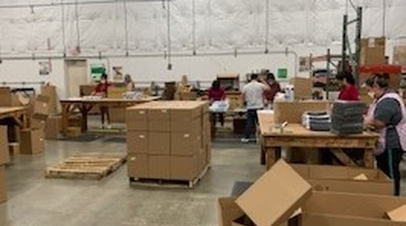 Laird Plastics employees in Miamisburg have been making face shields for health care workers and first responders for about three weeks. CONTRIBUTED