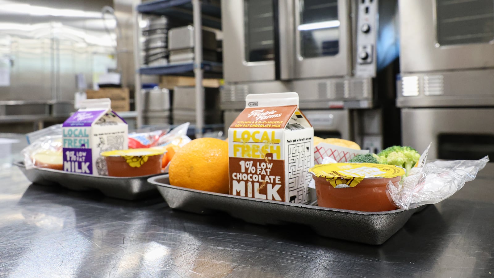 Typical lunches served to students by Fairborn City Schools. Milk, applesauce, vegetables and fruit are staples of each meal. BRYANT BILLING / STAFF