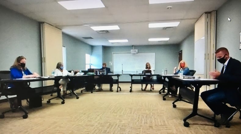 The divide between Lakota Board of Education member Lynda O'Connor (left) and Board President Brad Lovell (right) recently widen at Friday's virtual meeting (pictured) as they differed sharply on the board's efforts to find and appoint a new member to fill a vacant seat. (Photo By Michael D. Clark\Journal-News)