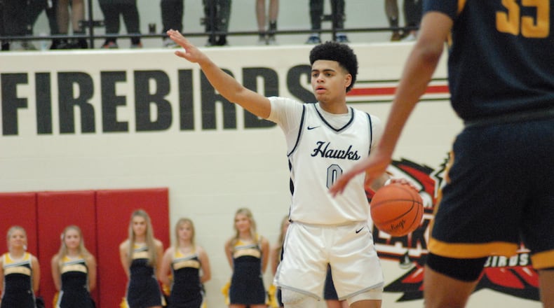 Lakota East guard Trey Perry calls out a play during a Division I sectional final contest against Moeller on Saturday at Lakota West. The Thunderhawks fell 51-50. Chris Vogt/CONTRIBUTED