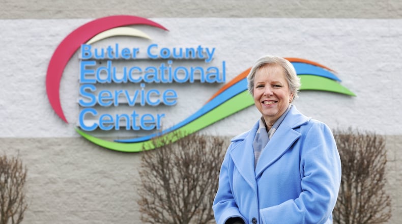 One of the jobs of Butler County Educational Service Center human resource specialist Anna Hennig is to help new substitute teachers get signed up for substitute jobs at schools in the area. NICK GRAHAM / STAFF