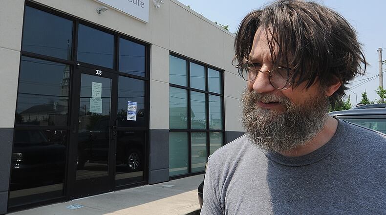 Jonathan Wright said he’s registered in Ohio’s medical marijuana program to help alleviate symptoms related to his blood cancer. The Montgomery County man stopped at Columbia Care in Dayton on Wednesday to pick up products that help him with difficulty sleeping and stomach issues. MARSHALL GORBY\STAFF