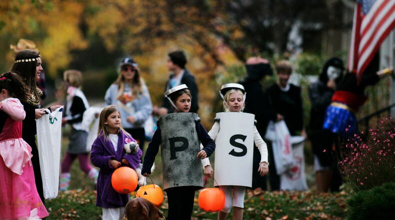 With trick-or-treaters expected to be out in smaller groups this year due to coronavirus, Ohio State Highway Patrol is reminding motorists and pedestrians to pay attention this Halloween. STAFF FILE PHOTO / JIM NOELKER
