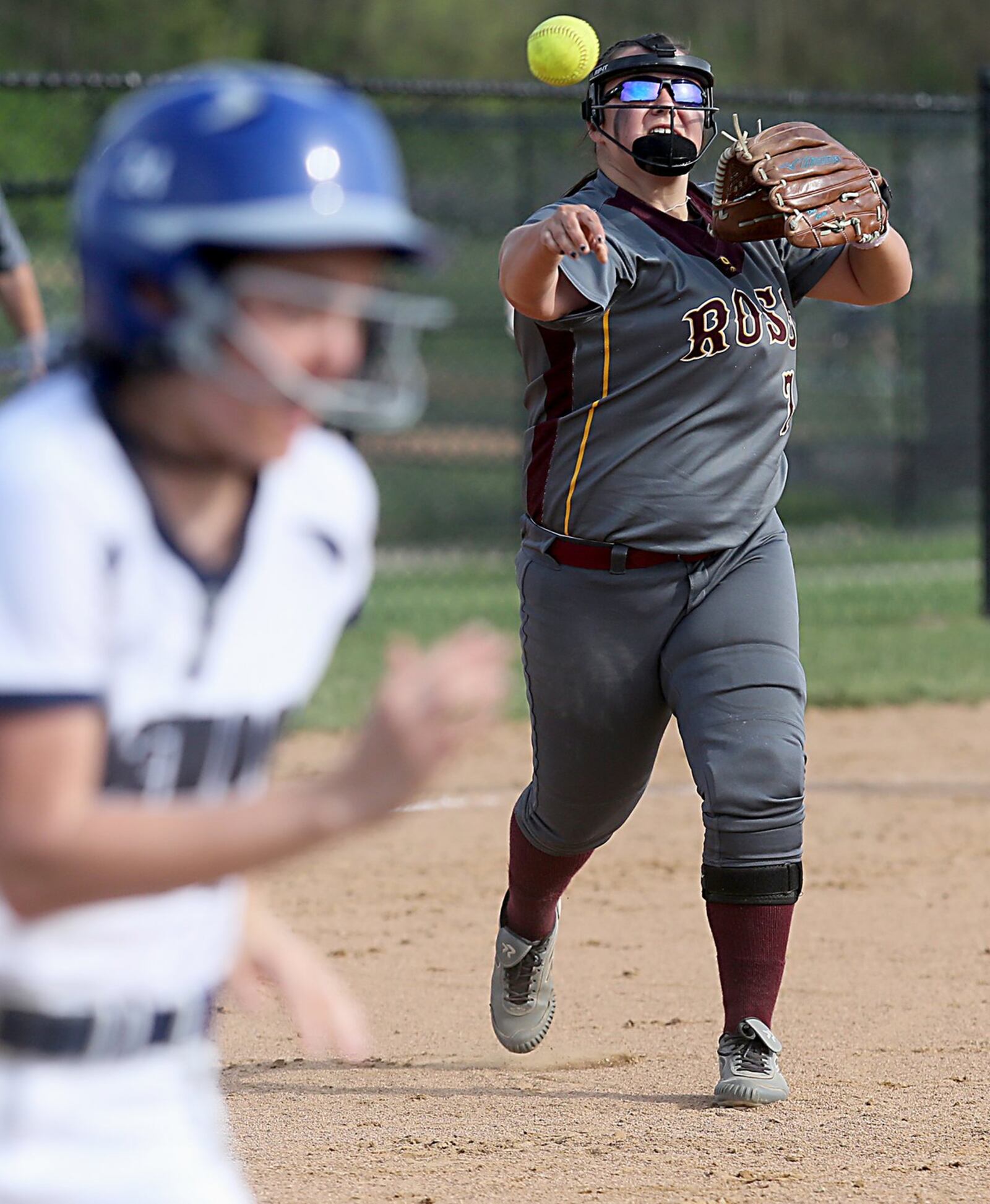 Ross pitcher Kenzie Meyer makes to throw to first base to get Edgewood’s Rileigh Todd during their game in Trenton on Friday. CONTRIBUTED PHOTO BY E.L. HUBBARD