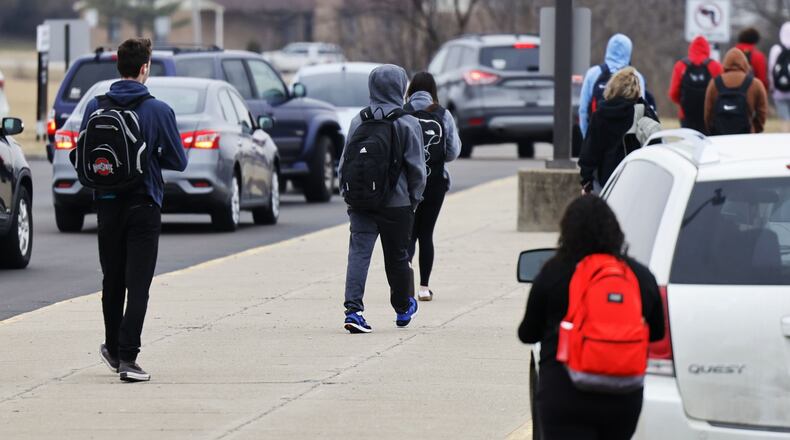 Students leave Lakota East High School at the end of the school day. NICK GRAHAM/STAFF