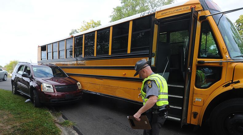 In this file photo from September, the Ohio State Highway Patrol investigated a crash involving a Dayton Public School bus in Harrison Twp. One child was injured. MARSHALL GORBY\STAFF