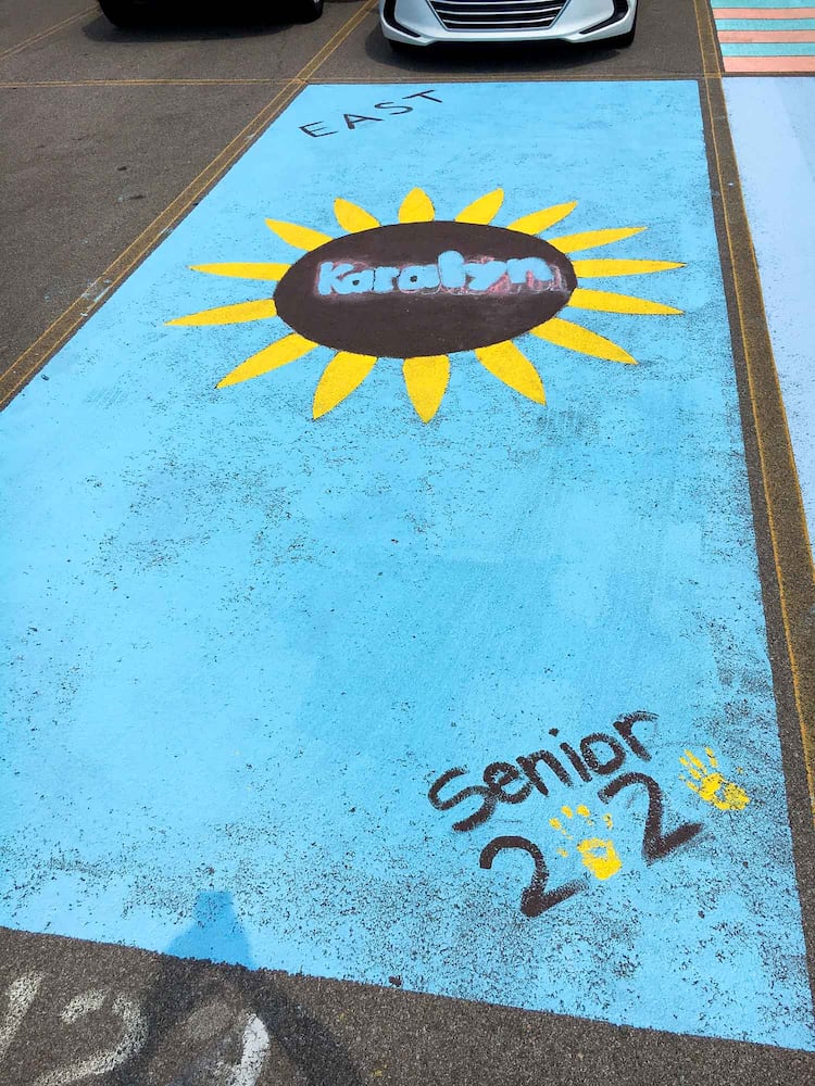 PHOTOS Lakota East seniors paint parking spots