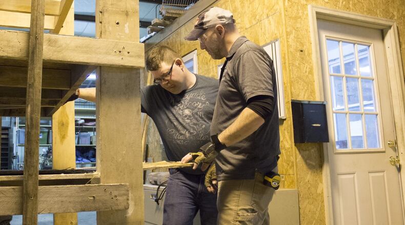 Jay D. Farmer (left) works with Skids Reimagined program manager Robb Barton. CONTRIBUTED
