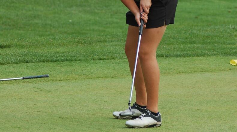 Monroe’s Sammi Blackburn putts during the Division II district girls golf tournament Wednesday at PipeStone Golf Course in Miamisburg. CONTRIBUTED PHOTO BY JOHN CUMMINGS