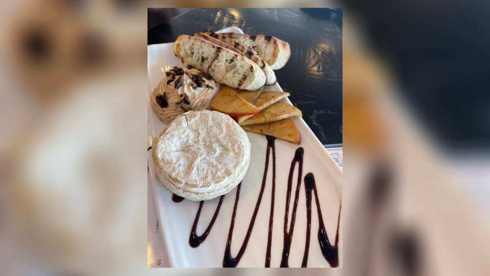 National Cheese Lover's Day happens annually on Jan. 20. This photo shows a brie appetizer at Tano Bistro in Hamilton, Ohio. STAFF FILE PHOTO