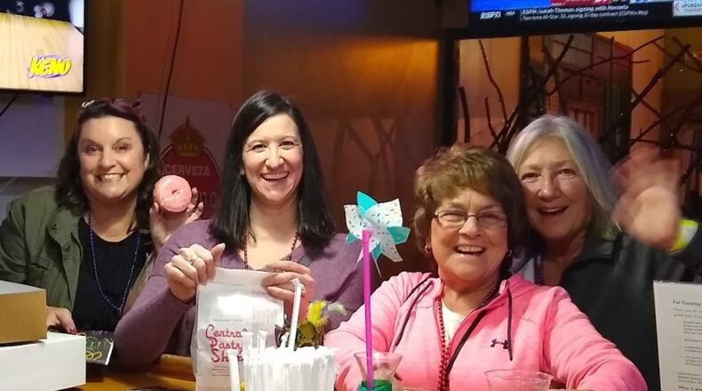 Downtown Middletown Inc. will host the 2024 Fat Tuesday Donut & Beer Walk from 6-9 p.m. Tuesday, Feb. 13. Pictured are participants from a previous year's event. CONTRIBUTED