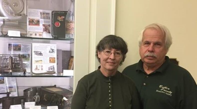 The Butler County Historical Society (BCHS) was invited to create a special exhibit to highlight the county’s history and attractions for the Thomas Worthington Center at the Ohio Statehouse, 1 Capitol Square, Columbus. Pictured, from left, Kathy Creighton, Butler County Historical Society Executive Director and volunteer Ed Creighton. CONTRIBUTED