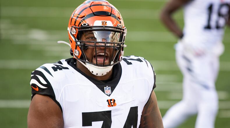 Cincinnati Bengals offensive guard Fred Johnson (74) reacts after a touchdown by Giovani Bernard in the first half of an NFL football game against the Tennessee Titans, Sunday, Oct. 4, 2020, in Cincinnati. (AP Photo/Emilee Chinn)