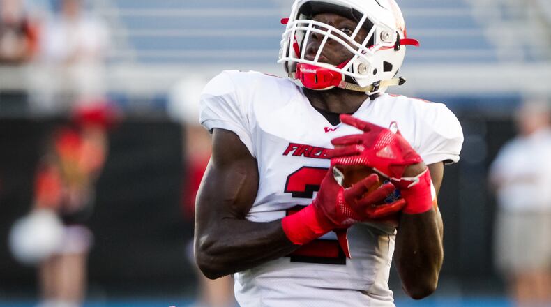 Lakota West's Alex Afari catches a pass during their football game against Hamilton Friday, Sept. 13, 2019 at Virgil M. Schwarm Stadium in Hamilton. Lakota West won 33-13. NICK GRAHAM/STAFF