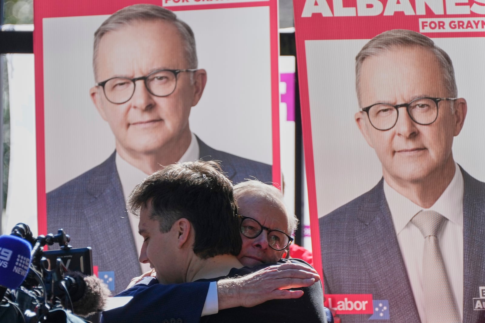 Australian Prime Minister Anthony Albanese embraces his son Nathan as he arrives at a polling booth to vote in his electorate in Sydney, Saturday, May 3, 2025. (AP Photo/Rick Rycroft)