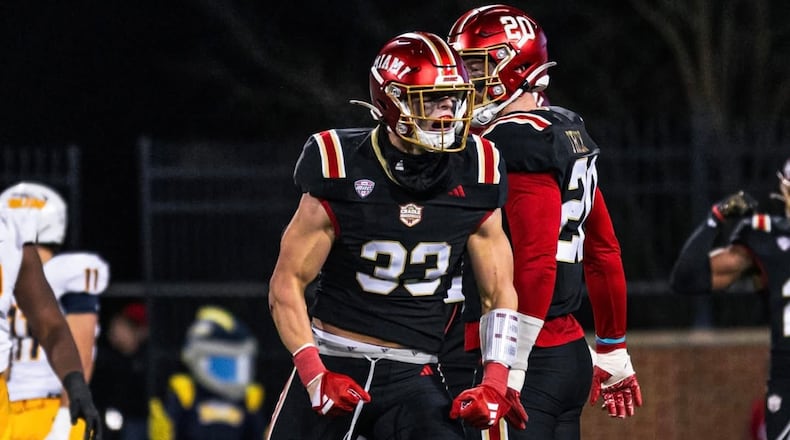 Miami’s Jackson Kuwatch celebrates after making a tackle against Toledo earlier this season. MIAMI ATHLETICS PHOTO