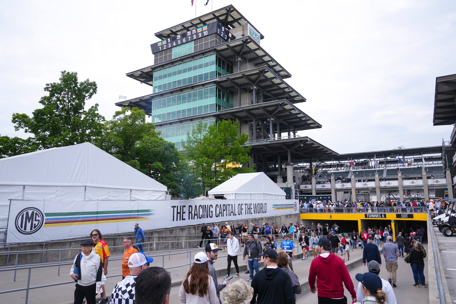 Fans make their way into the track before the start of the Indianapolis 500 auto race at Indianapolis Motor Speedway in Indianapolis, Sunday, May 25, 2025. (AP Photo/Michael Conroy)
