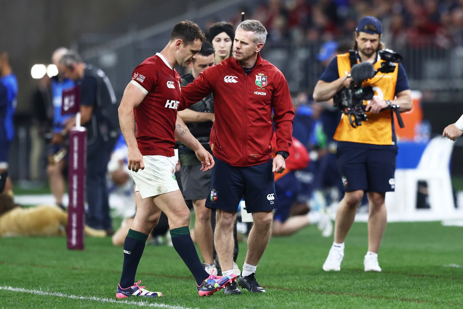 Tomos Williams of the British & Irish Lions is assisted from the field during their rugby match against the Western Force in Perth, Australia, Saturday, June 28, 2025. (AP Photo/Trevor Collens)