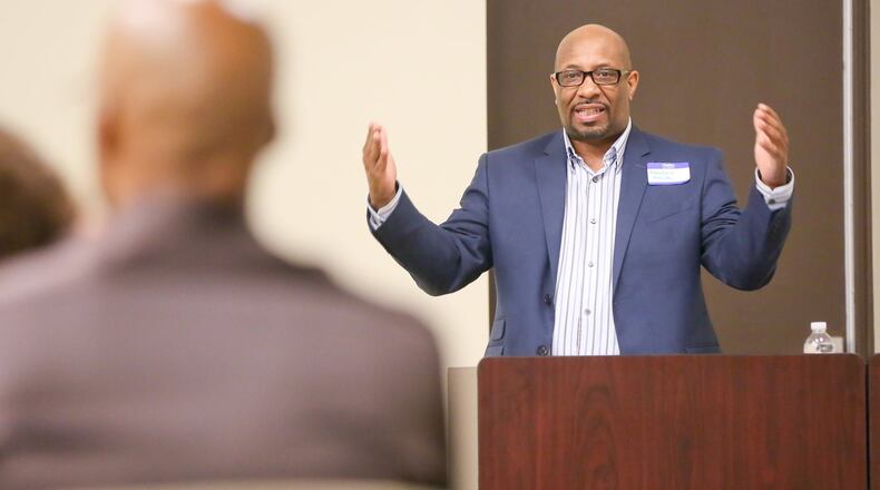 Dr. Matthew Smith talks during a Celebrating Fathers & Families conference. He would like to see more fathers become involved in the fight against infant mortality.