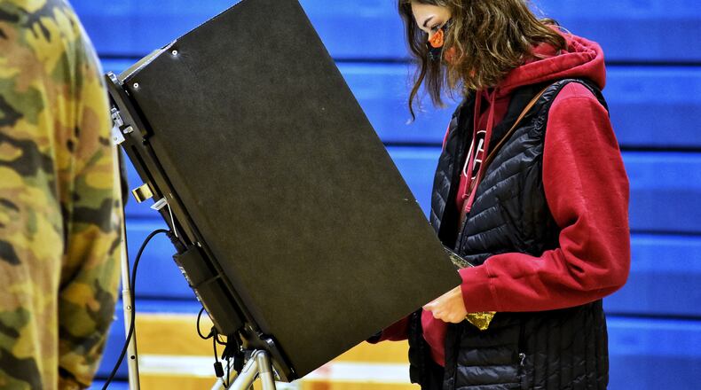 Alexys Napier, 18, votes for the first time on election day Tuesday, Nov. 3, 2020 at Wilson Middle School in Hamilton. NICK GRAHAM / STAFF