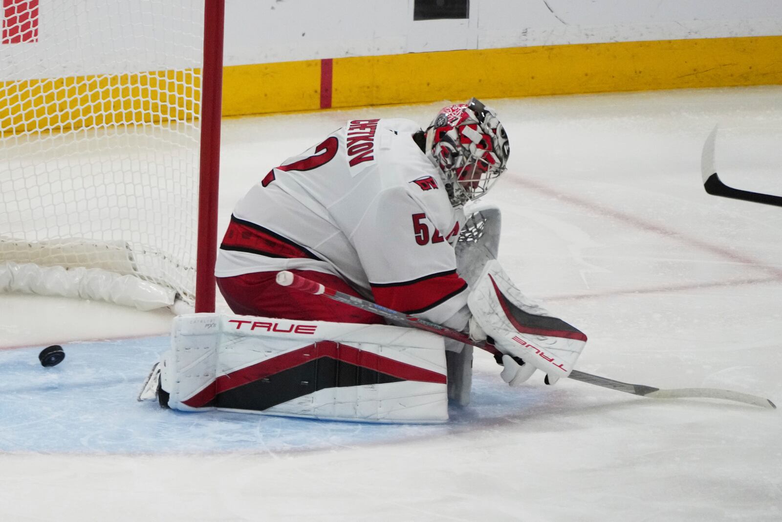 The puck gets past Carolina Hurricanes goaltender Pyotr Kochetkov on a goal scored by Florida Panthers defenseman Niko Mikkola during the third period in Game 3 of the NHL hockey Stanley Cup Eastern Conference finals Saturday, May 24, 2025, in Sunrise, Fla. (AP Photo/Lynne Sladky)