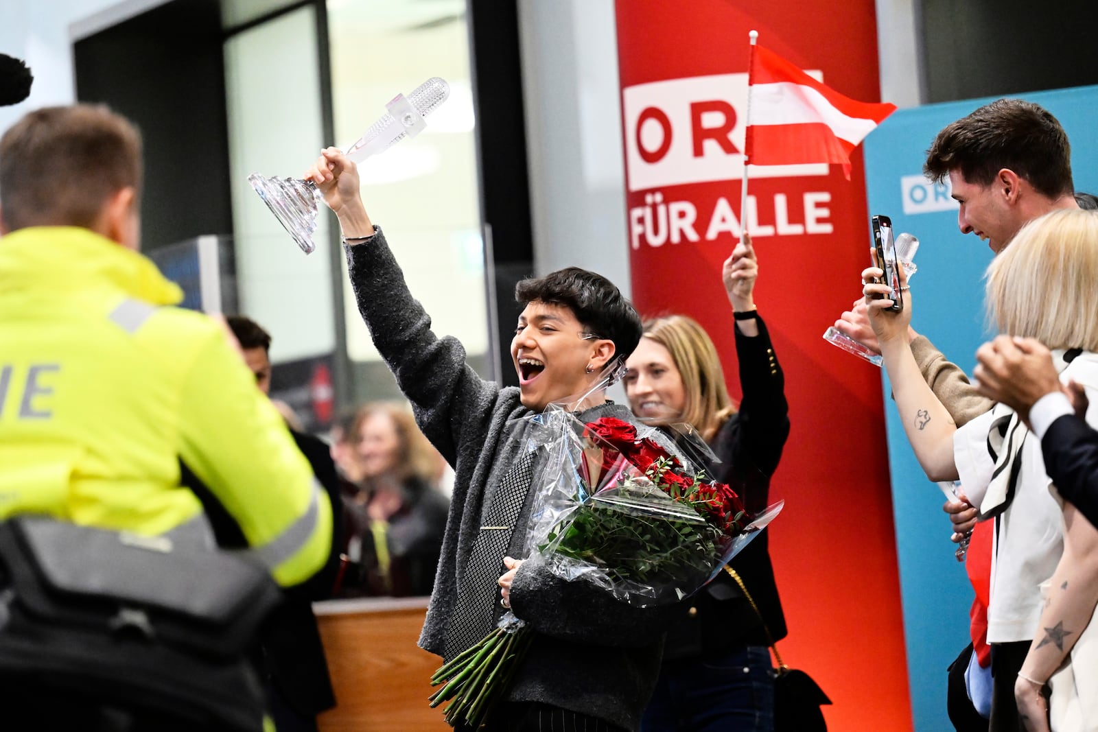 JJ, center, from Austria arrives at the airport in Vienna, Austria, Sunday, May 18, 2025, after winning the Grand Final of the 69th Eurovision Song Contest, in Basel yesterday. (AP Photo/Denes Erdos)