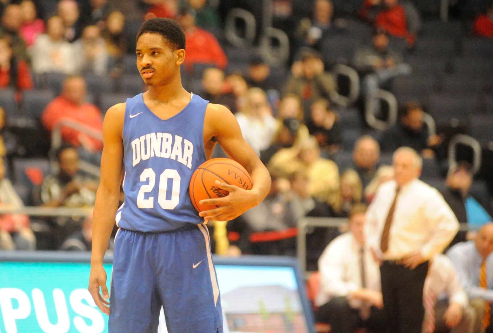 Michael Elmore of Dunbar holds the ball during a 27-26 defeat of Fenwick in a D-II sectional final on Wednesday night at UD Arena. MARC PENDLETON / STAFF