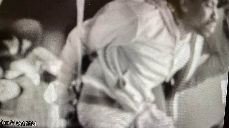 Clifford Owensby is shown by police cruiser cam in back of a Dayton police cruiser after being arrested.